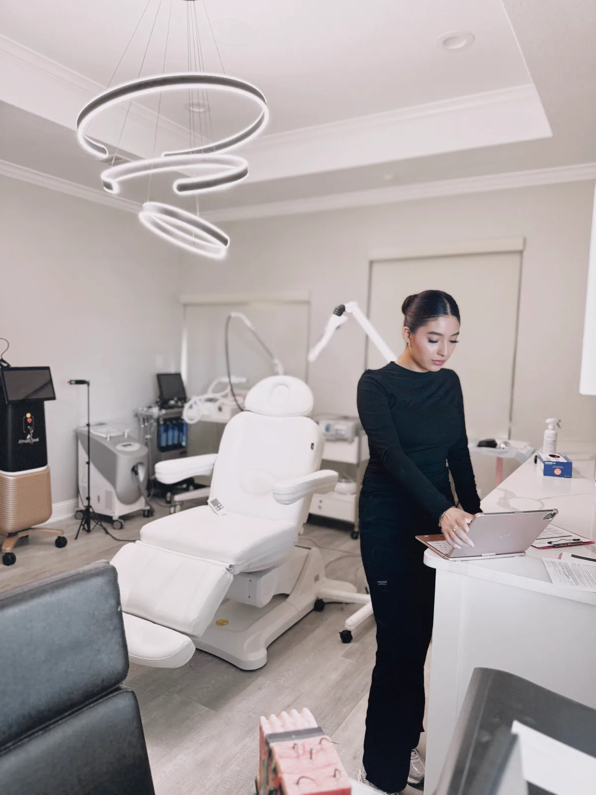 Keili, our esthetician, preparing the clinic treatment room